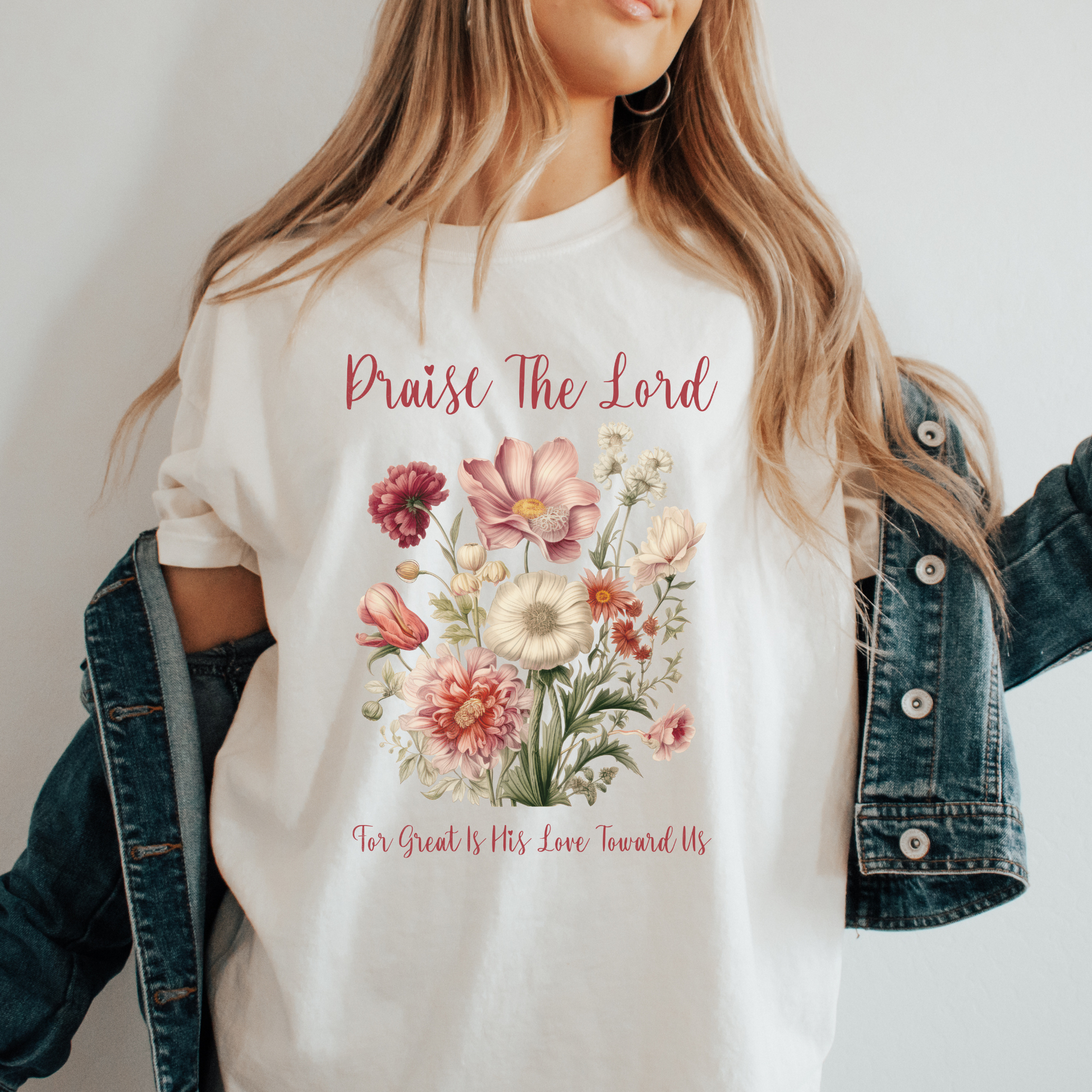 a women wearing a boho christian bible verse shirt that says praise the lord for great is his love toward us