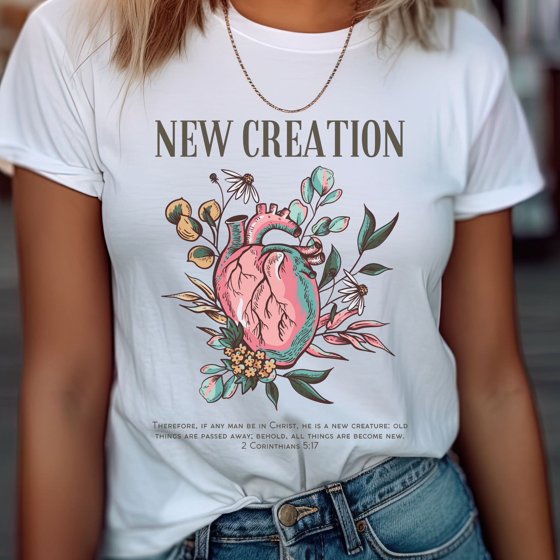 women wearing a white crewneck short sleeve trendy womens christian shirt that says new creation in a boho style design