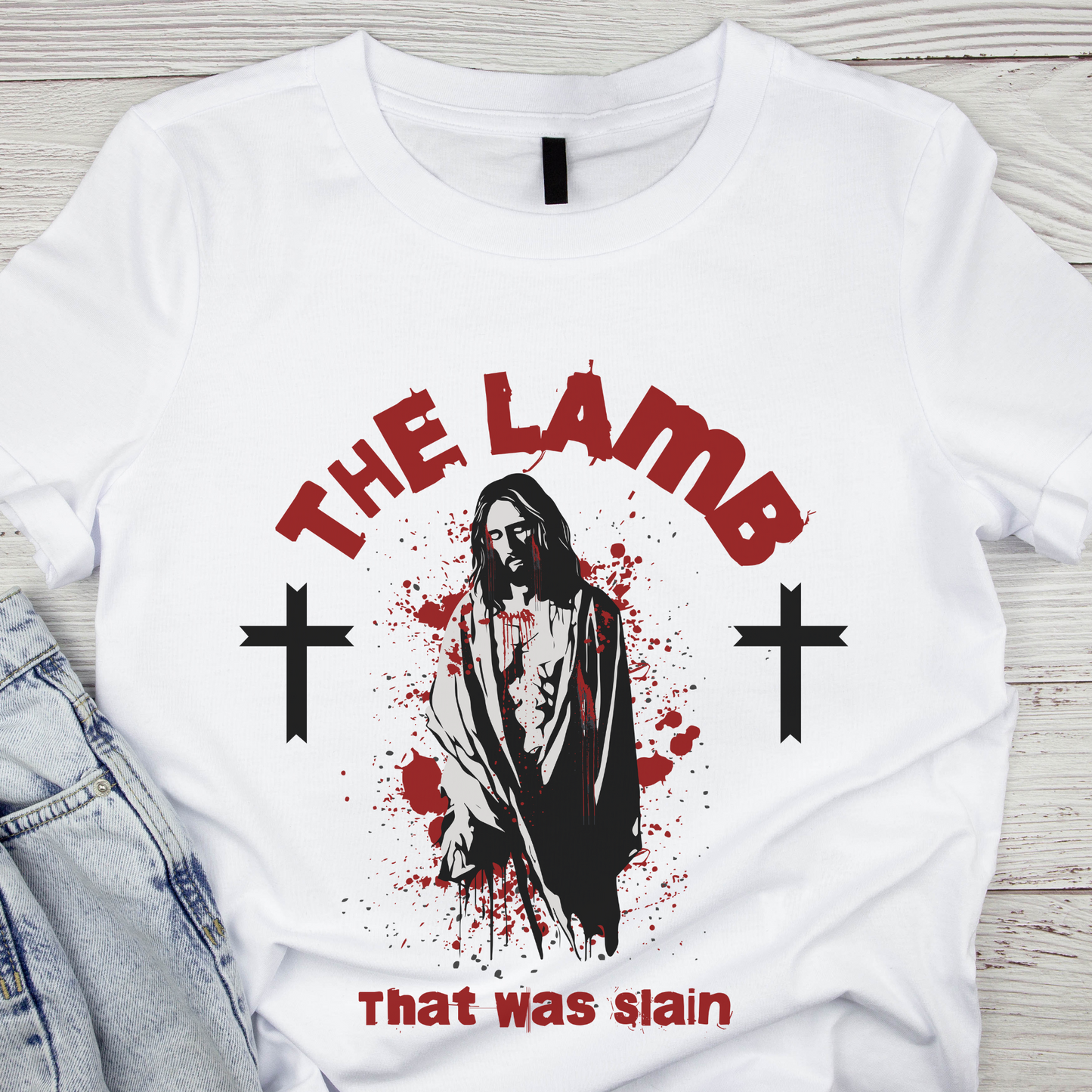 a christian graphic tee that says the lamb that was slain with a image of Jesus