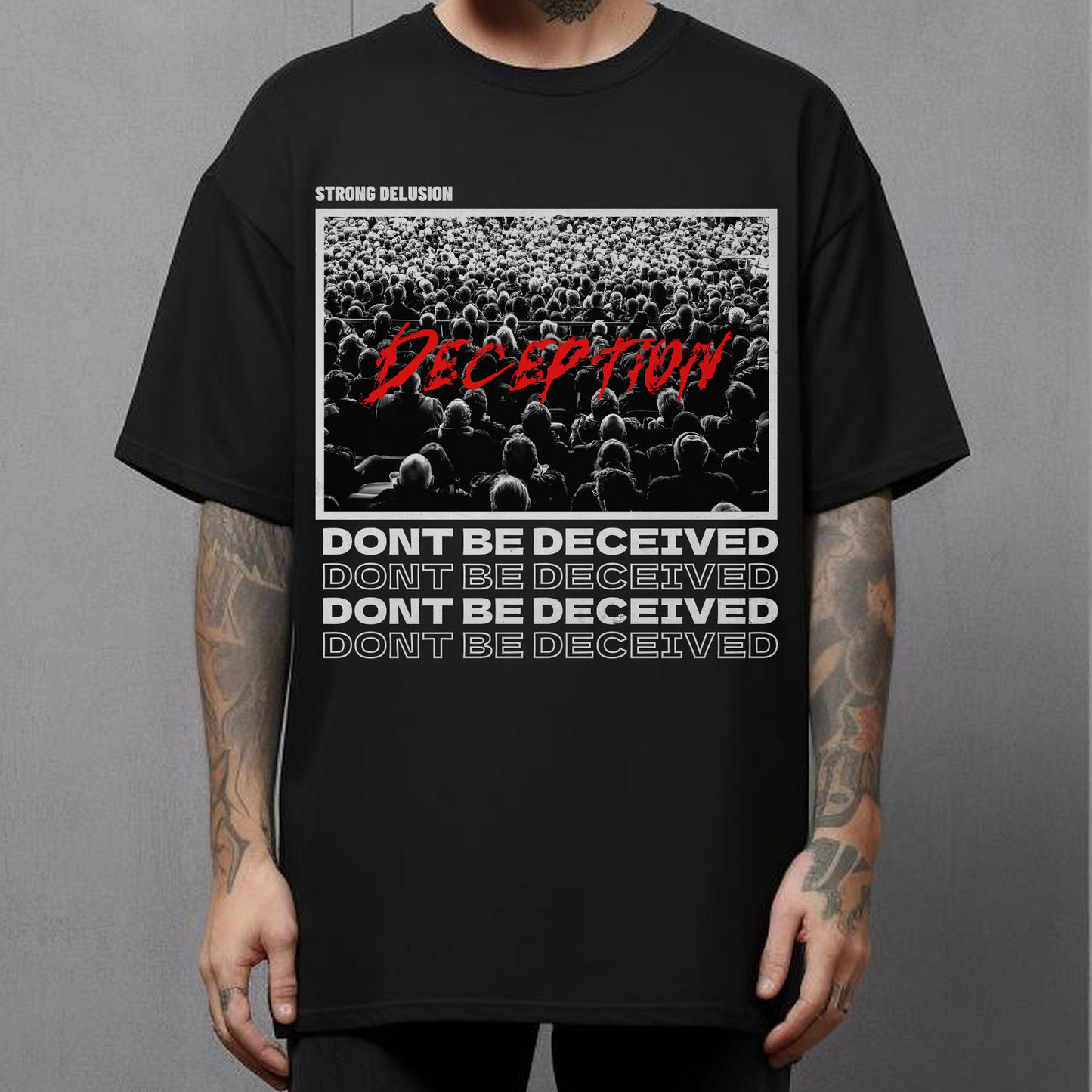 man standing wearing a men's religious christian graphic tshirt that says dont be deceived in christian streetwear style shirt